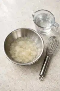 Step-by-step preparation of bariatric gelatin trick recipe in a bowl.